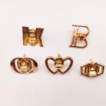 Wholesale New Design Letter Hollowed-Out Metal Turn Locks Custom Brand Letter Logo Push Twist Lock for Bag Accessories