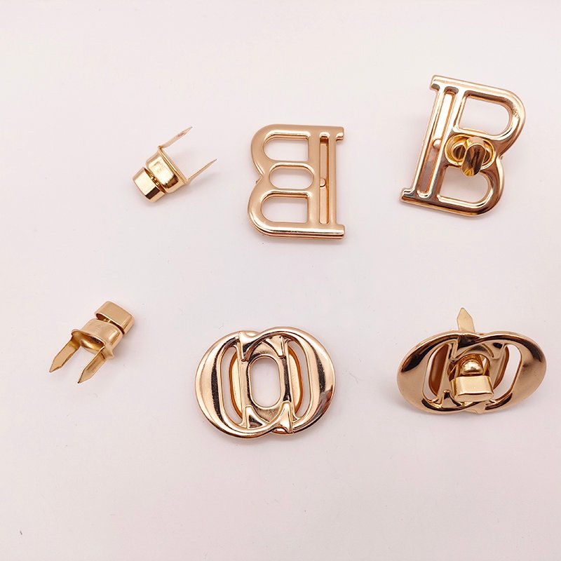 Wholesale New Design Letter Hollowed-Out Metal Turn Locks Custom Brand Letter Logo Push Twist Lock for Bag Accessories