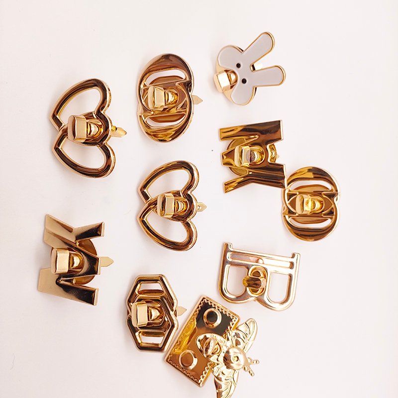 Wholesale New Design Letter Hollowed-Out Metal Turn Locks Custom Brand Letter Logo Push Twist Lock for Bag Accessories